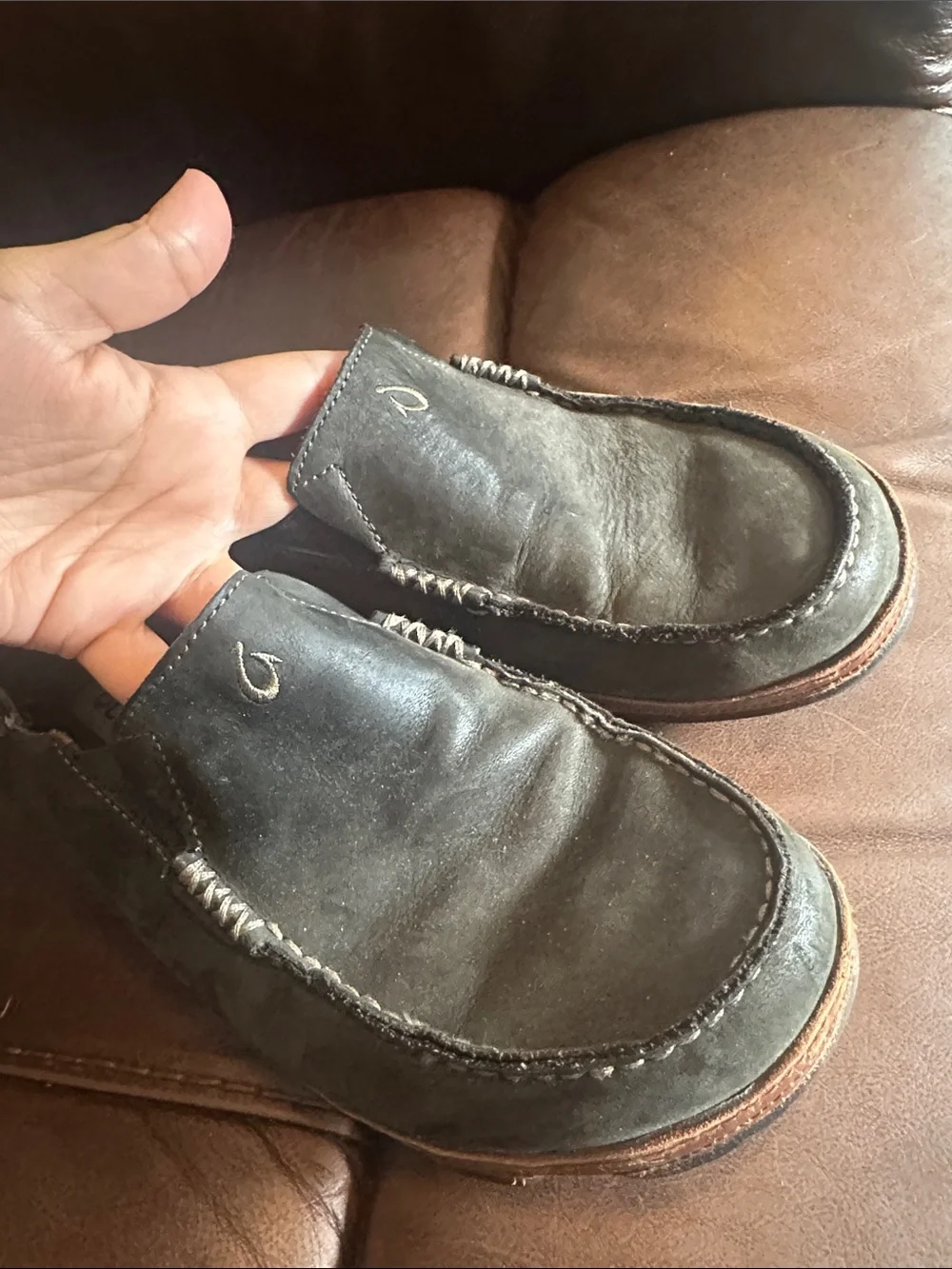 OluKai Men's Black Slip-On Loafers with Brown Trim